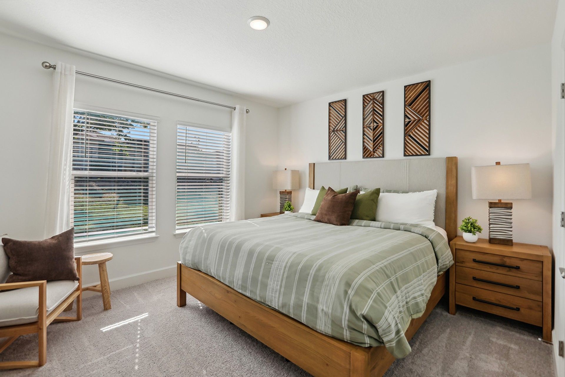 Elegant Spring Hill bedroom features modern wood accents and expansive natural light.