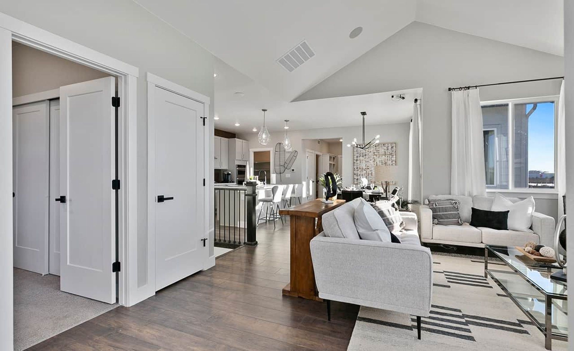 Experience elegant living with vaulted ceilings, rich hardwood floors, and designer lighting in Trailside on Harmony.