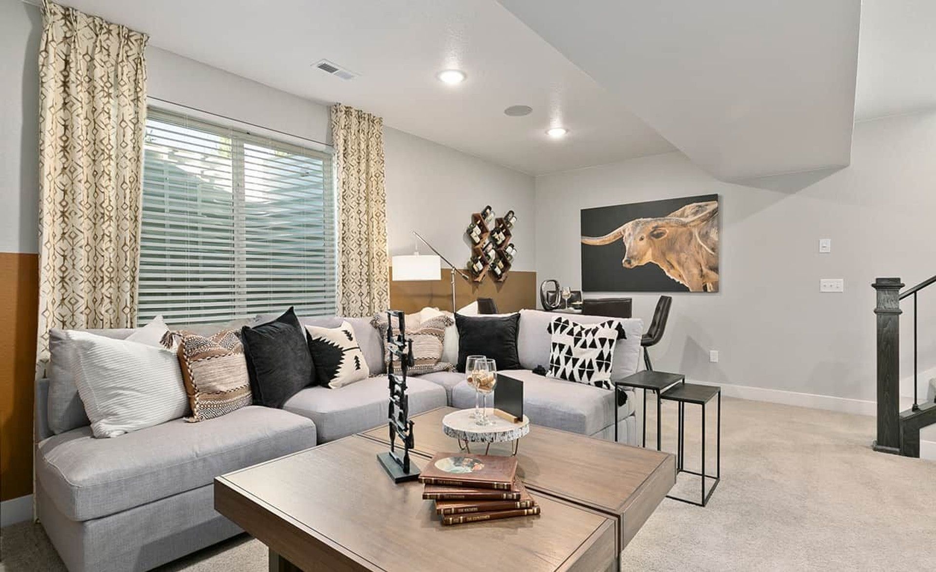 Experience opulent comfort in this Trailside on Harmony living room, featuring plush furnishings and elegant decor.