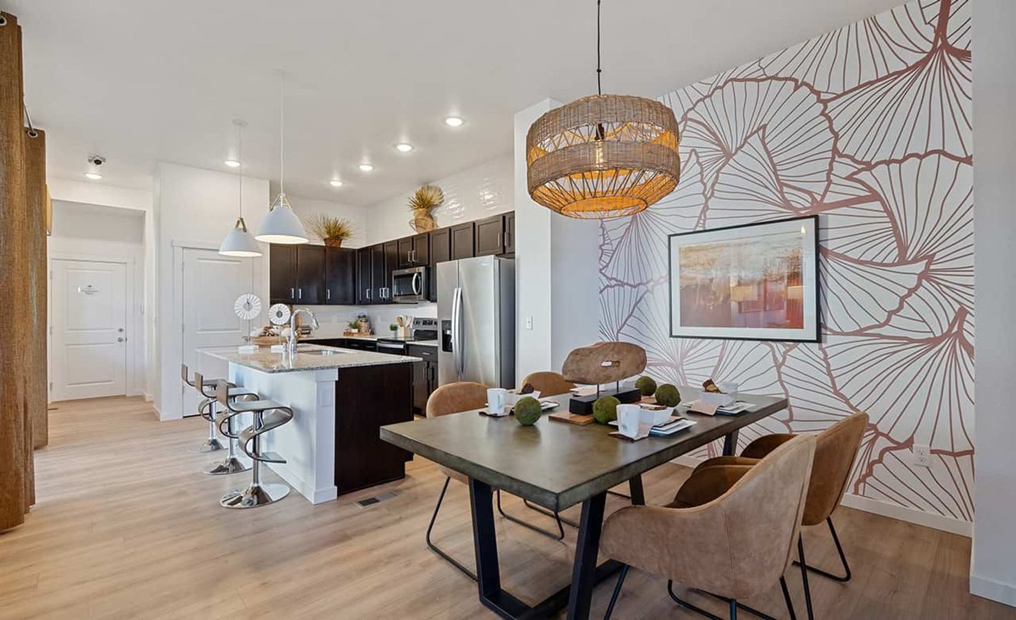 Experience refined elegance with a floral accent wall and chic lighting in Trailside on Harmony.