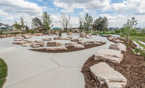 Discover natural stone seating and artfully curved pathways in Trailside on Harmony, Colorado.