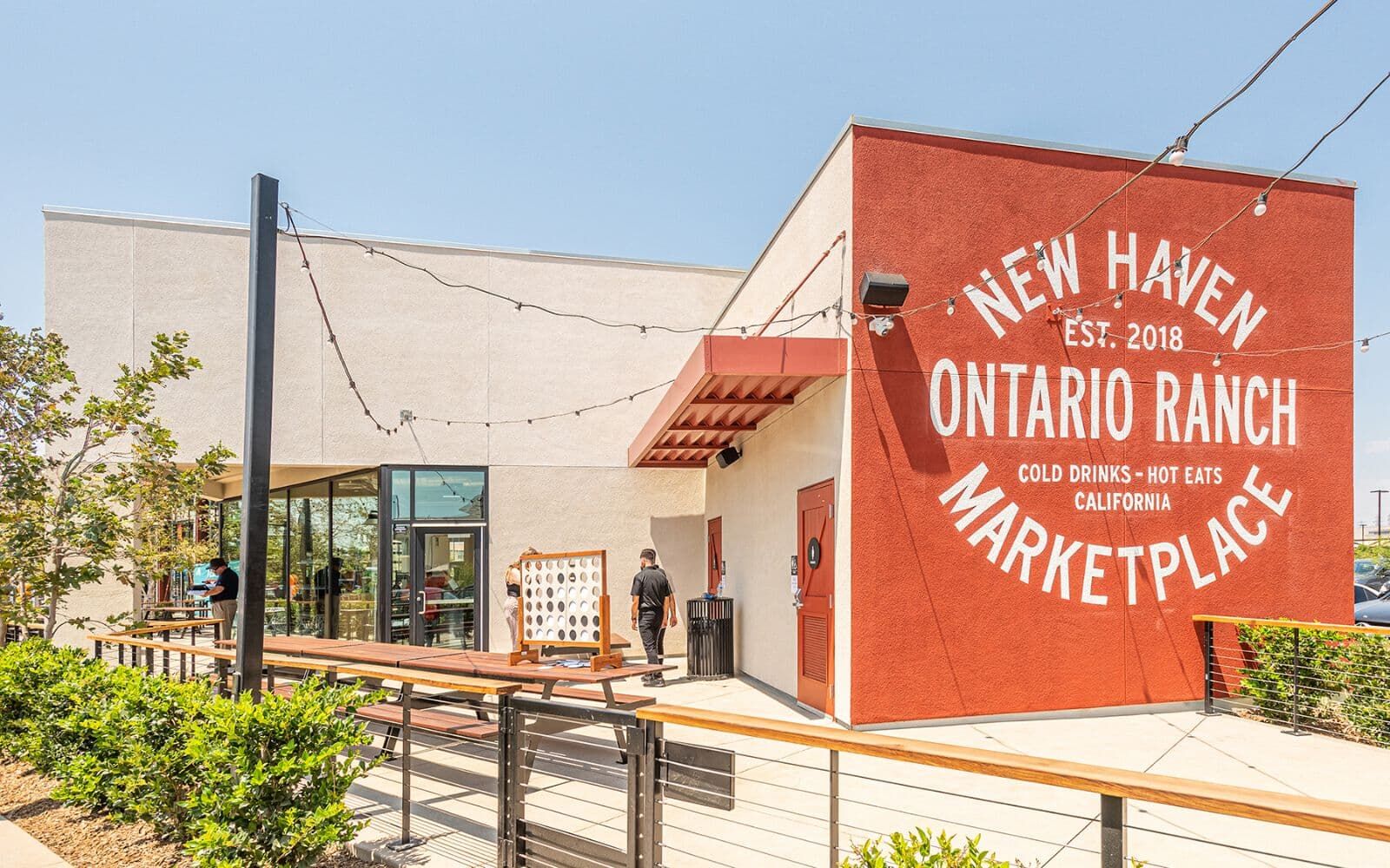 Mural and outdoor seating for New Haven Marketplace.