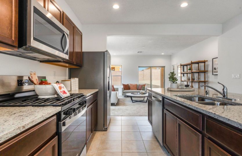 Granite countertops and stainless steel appliances compliment the kitchen