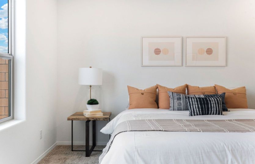 Cozy owner's suite with lots of lighting and its own private bath
