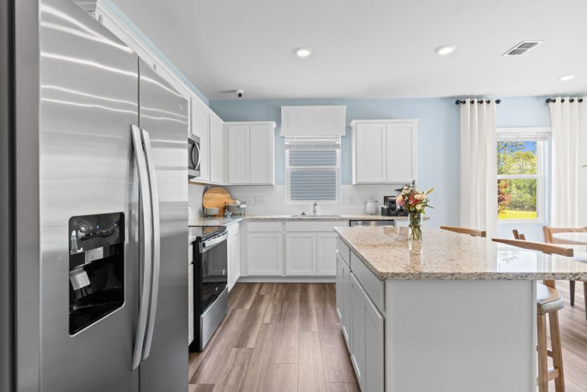 Stainless Steel Appliances. Model Home Representation.