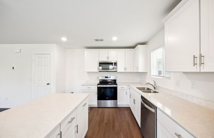 Spacious kitchen with abundant cabinet space *photos are not of actual home, some features vary