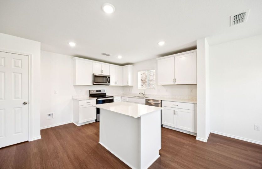 Eat-in island kitchen *photos are not of actual home, some features vary