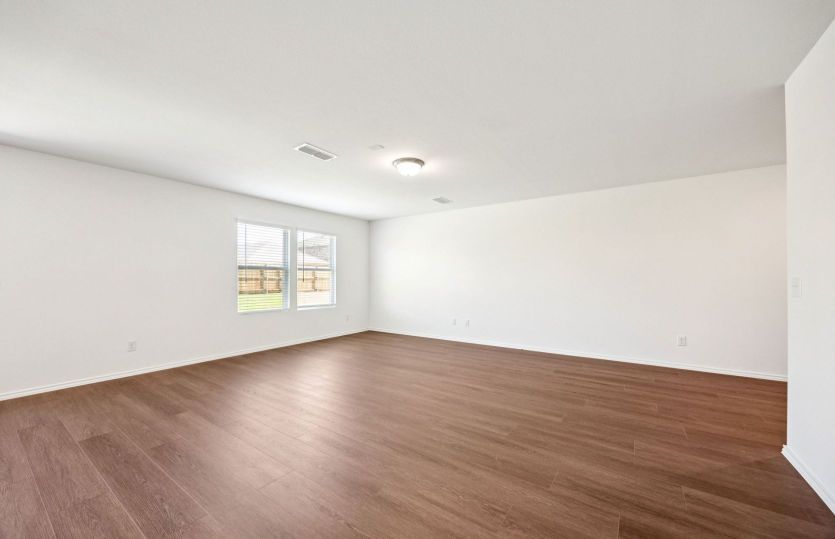 Gathering room with large windows *photos are not of actual home, some features vary
