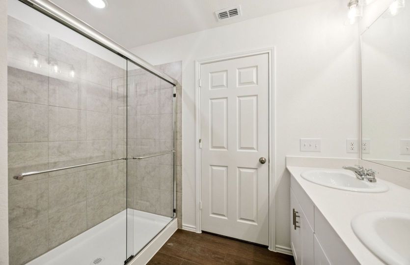 Owner's bath with large shower *photos are not of actual home, some features vary