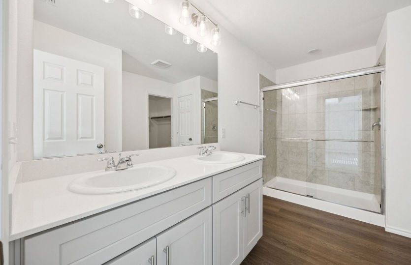 Owner's bath with double vanity and shower