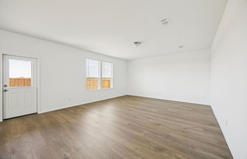 Spacious gathering room with access to backyard