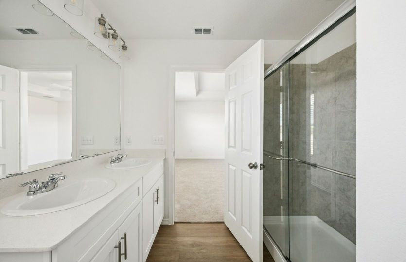 Owner's bath with double vanity and shower
