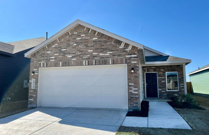 The Kemp, a one-story home with 2-car garage, home exterior LS103 *exterior features may differ