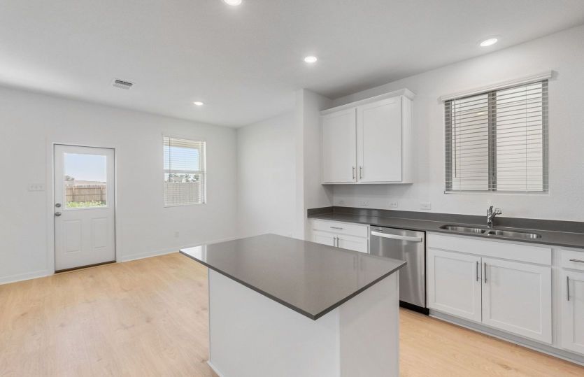 Representational Photo- Kitchen Open to the Dining Area