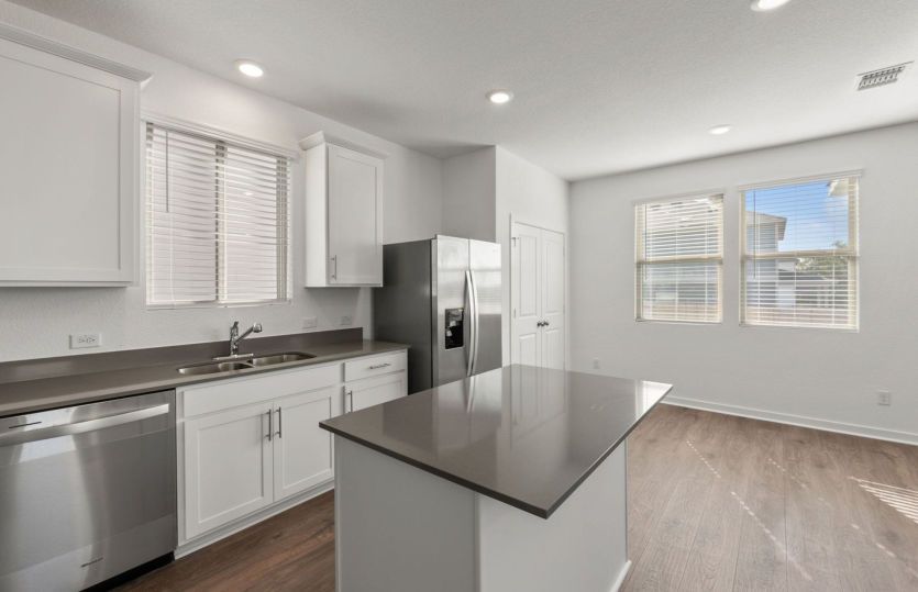Representational Photo- Kitchen Open to the Dining Area
