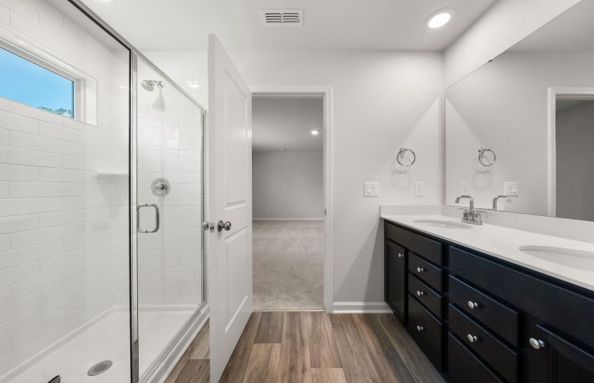 Rosella #101 - Owner's Bath with Glass Walk-In Shower