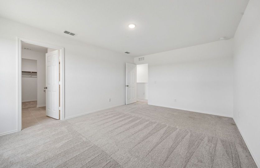 Primary suite with private bath and closet
