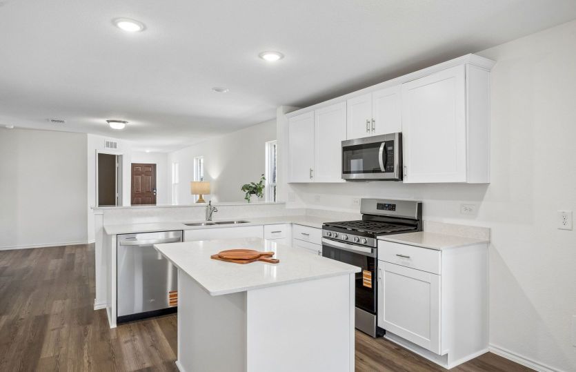 Open concept kitchen with view of gathering room *model representation