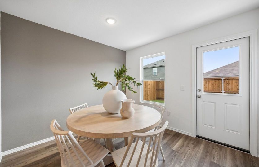 Dining nook with access to backyard *model representation