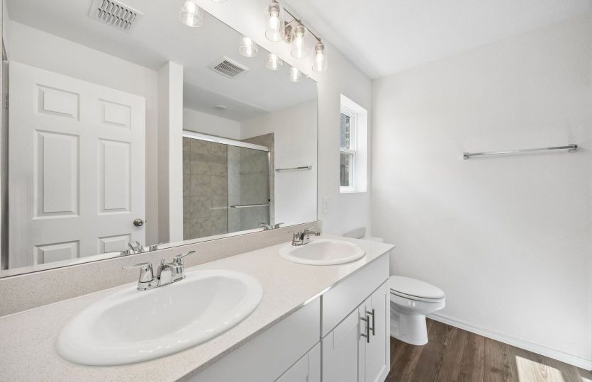 Private primary bath with double vanity *model representation