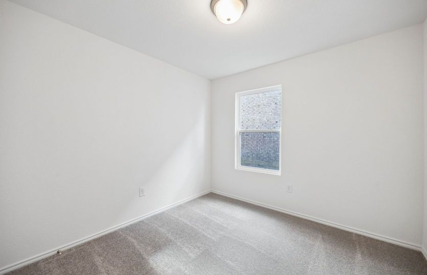 Spacious secondary bedroom *model representation