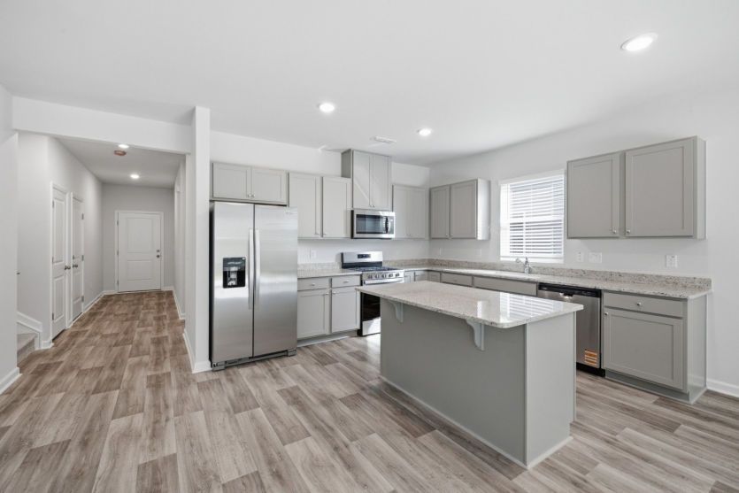Starling Lot 23 - Kitchen offers Light, Functionality, Walk-In Pantry & Prep Space