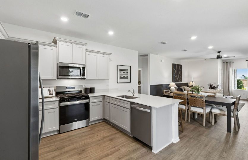 Spacious kitchen overlooking main gathering area *model representation