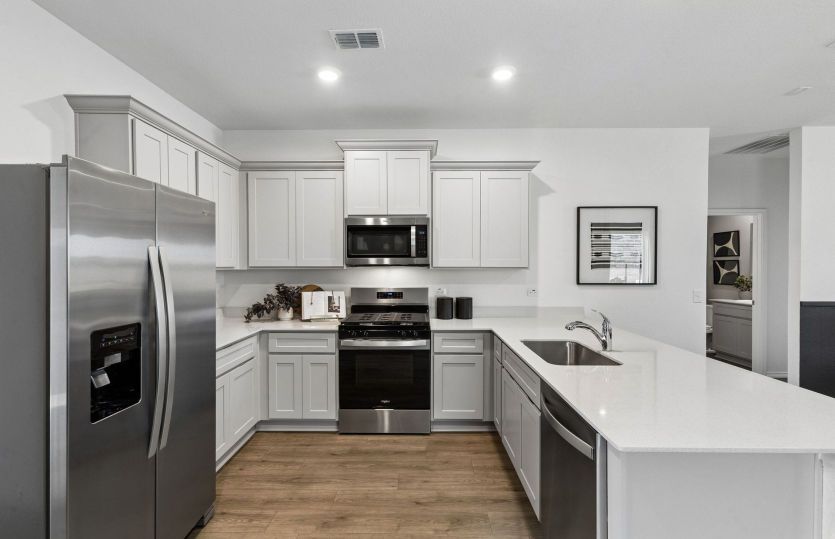 Abundant cabinet space in kitchen *model representation