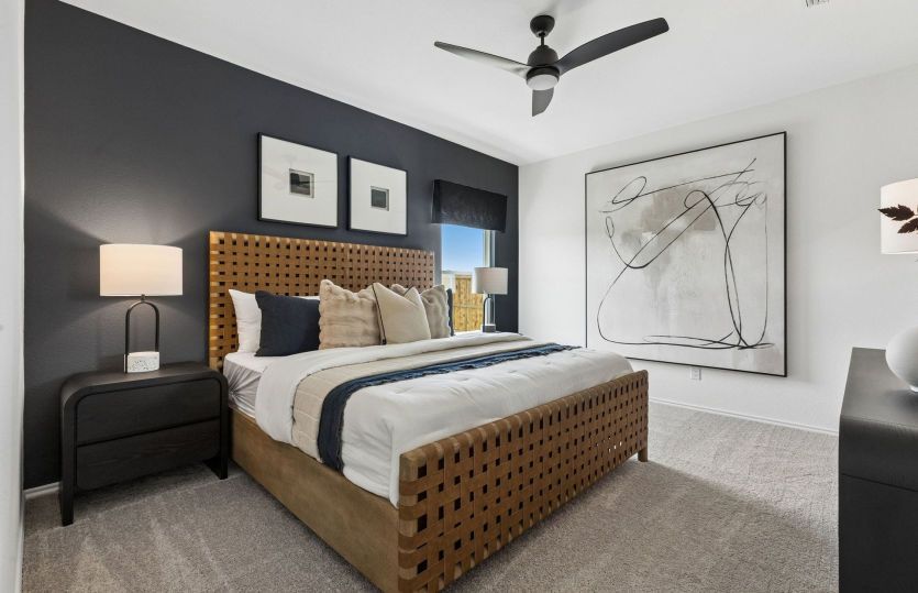 Spacious primary suite *model representation