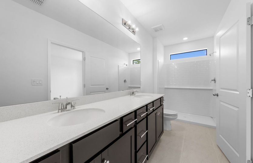 Owners bathroom with dual sinks