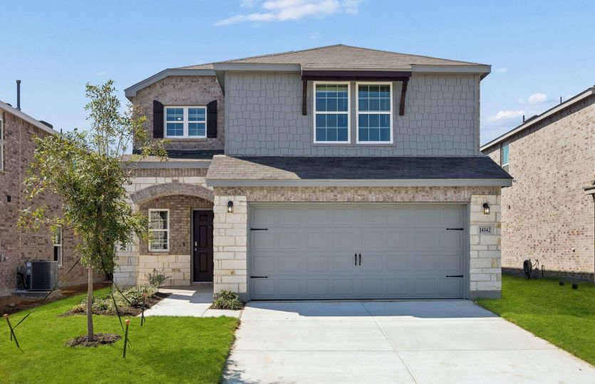 The Coolidge, a 2-story new construction home with a two car garage