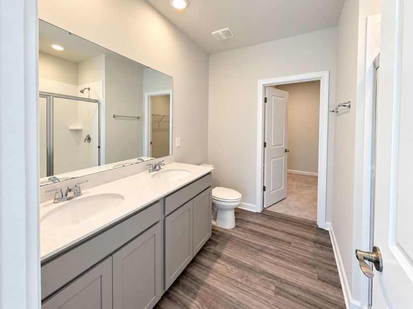 Beautiful owner’s bath with a clean, relaxing feel.