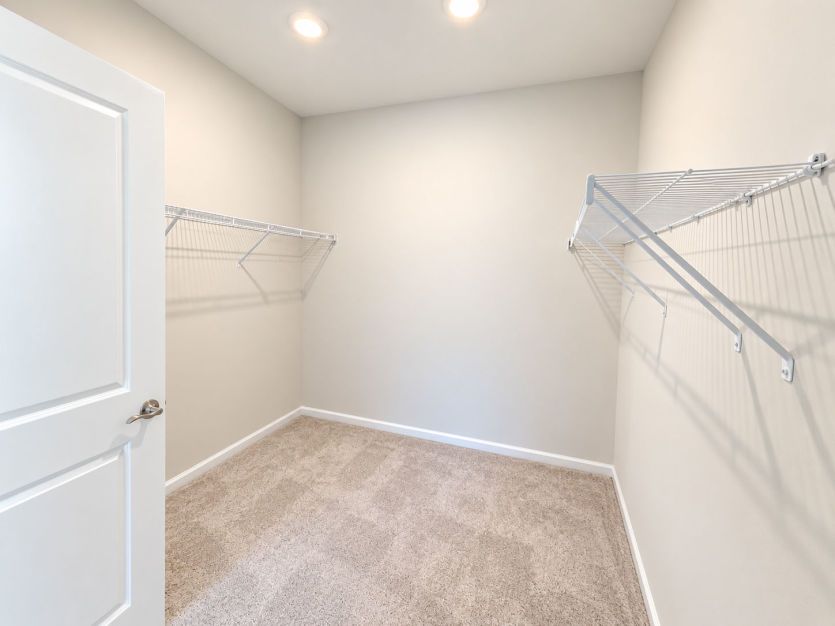 Walk-in closet with plenty of room for storage and organization.