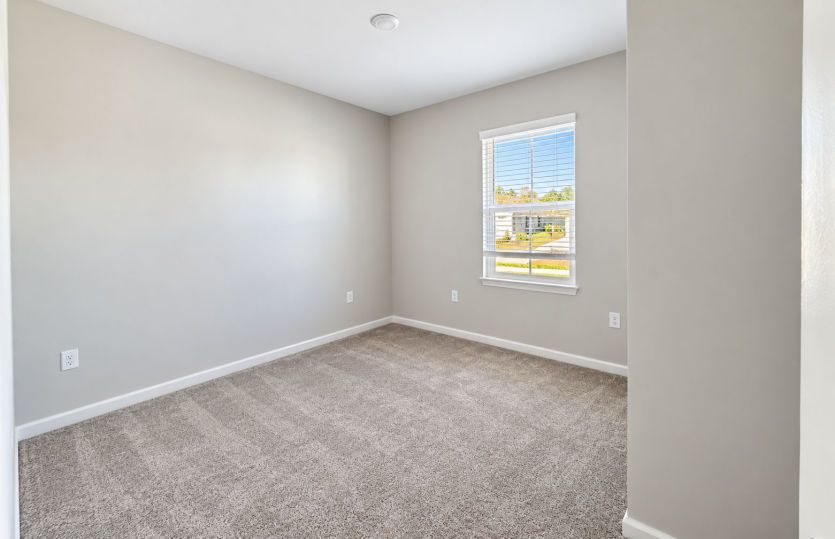 Comfortable secondary bedroom with a bright and inviting feel.