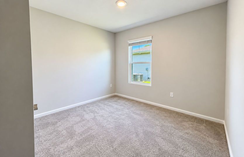 Versatile third bedroom perfect for guests, family, or a home office.