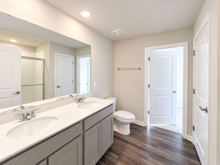 Beautiful owner’s bath with modern finishes and a polished feel.