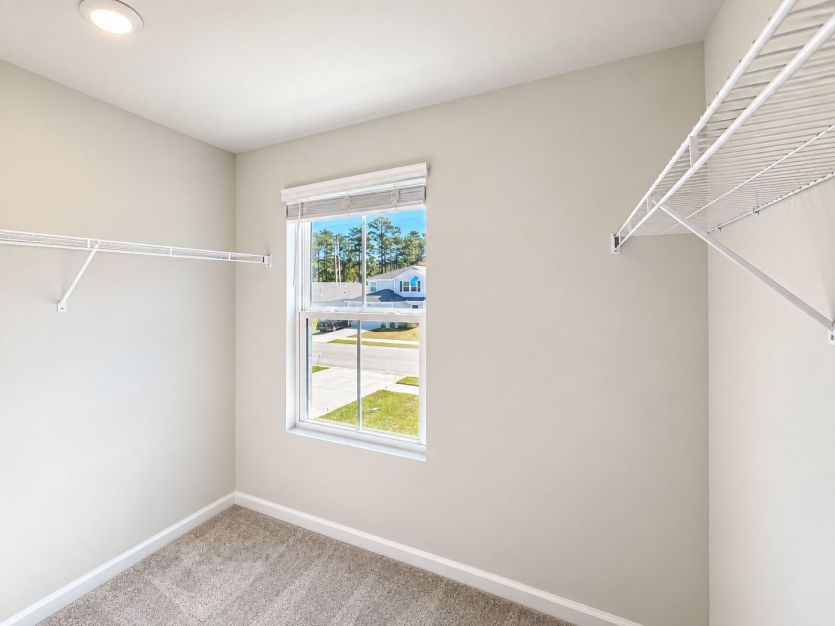 Generous walk-in closet with ample storage for everyday essentials.