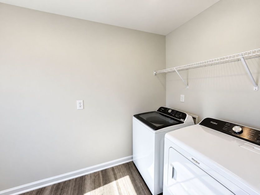 Convenient laundry room designed to keep everyday tasks organized.