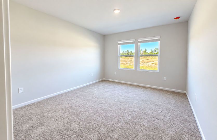 Peaceful owner’s bedroom offering the perfect place to unwind.