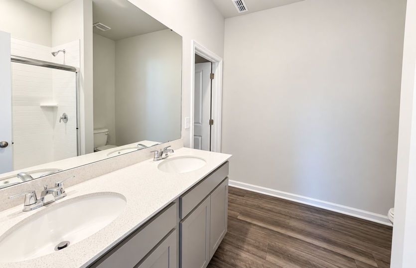 Refined owner’s bath designed with comfort and convenience in mind.