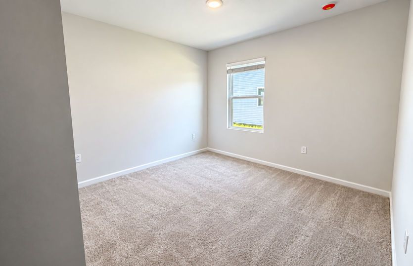 Versatile third bedroom ideal for guests, hobbies, or a home office.