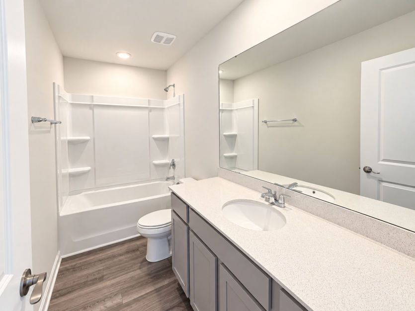 Upstairs bath conveniently situated between the two loft bedrooms.