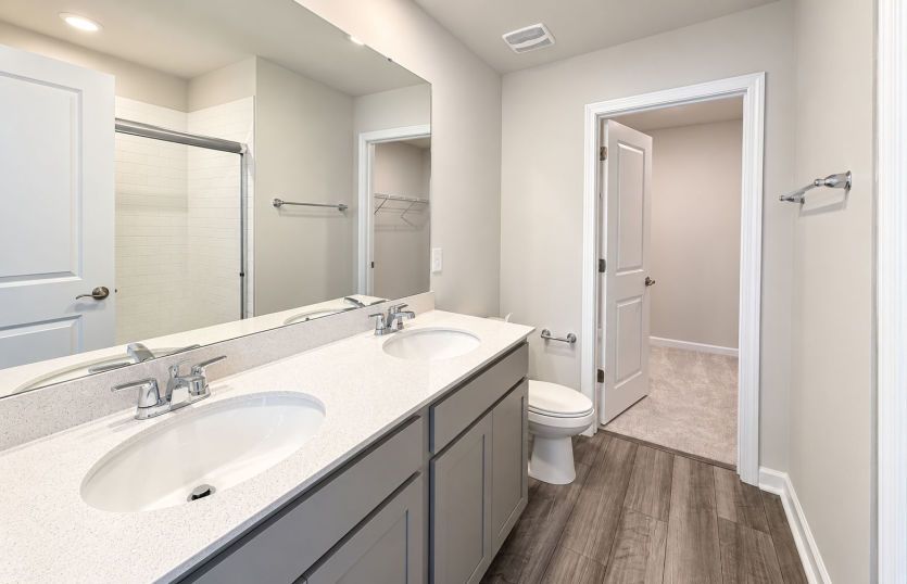 Owner’s bath featuring a clean, polished look.