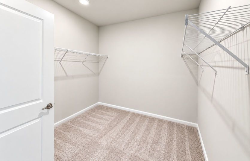 Owner’s walk-in closet with ample room for clothing, shoes, and more.