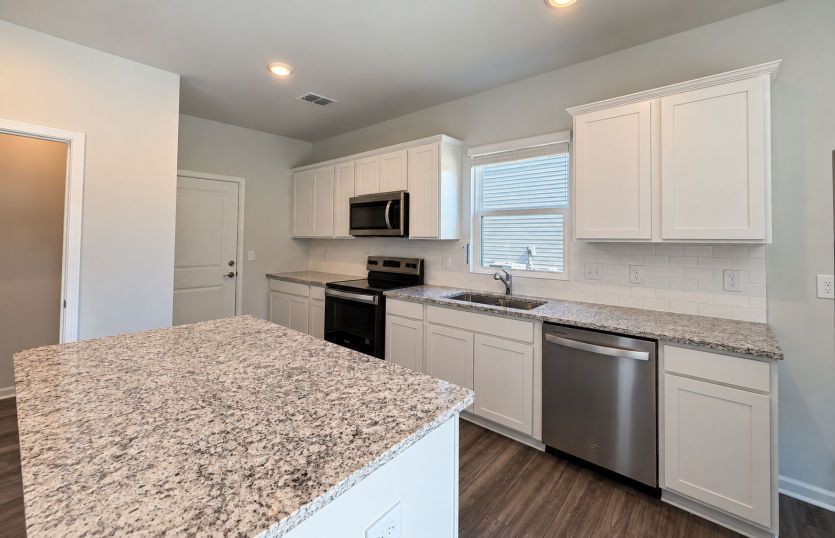 Kitchen blends everyday functionality with a polished space for cooking and gathering.