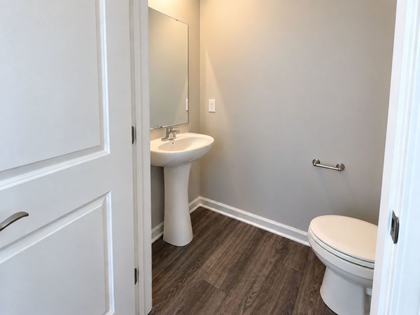 Convenient powder room adds comfort and functionality for guests.