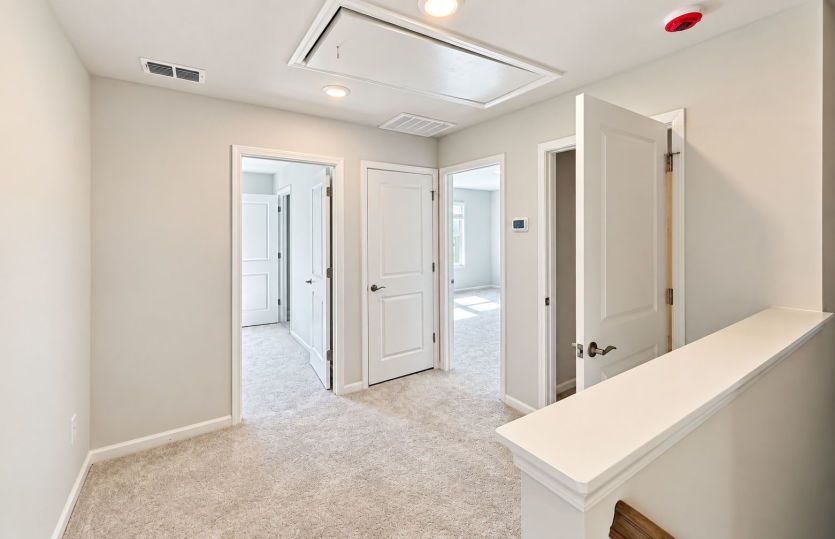 Upstairs hallway provides an easy connection between the bedrooms