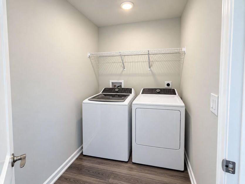 Dedicated laundry room keeps daily routines organized and out of the way.