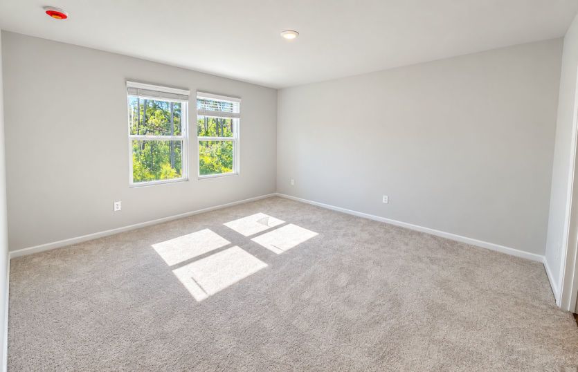 Owner’s suite offers a private retreat tucked away from the main living areas.