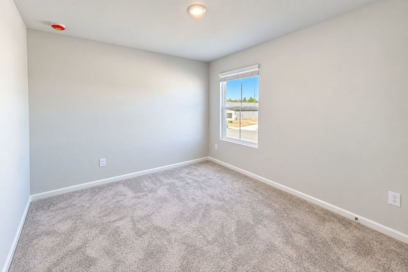 Second bedroom offers a welcoming space for family, guests, or everyday living.